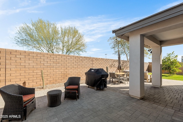 view of patio with a grill