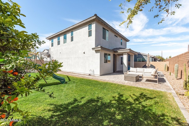 rear view of property with an outdoor living space, a yard, a patio, and a playground