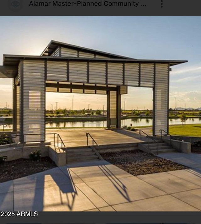 view of patio with a water view