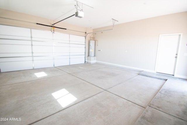 garage featuring water heater, baseboards, and a garage door opener