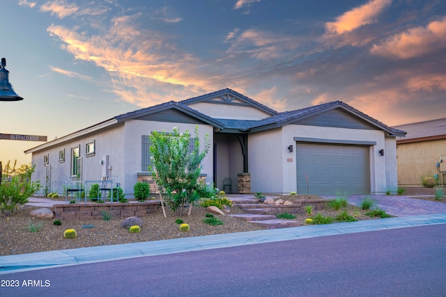 ranch-style home featuring a garage