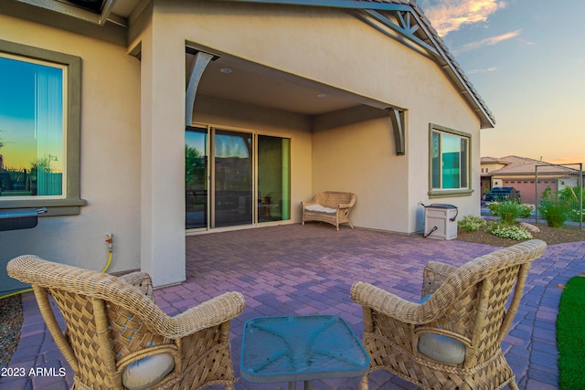 view of patio terrace at dusk