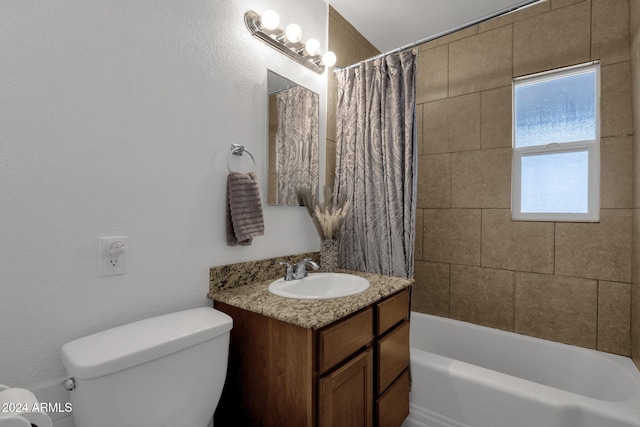 full bathroom featuring shower / tub combo with curtain, vanity, and toilet