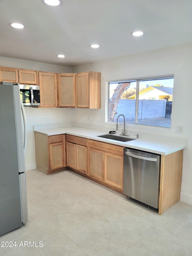 kitchen with appliances with stainless steel finishes and sink