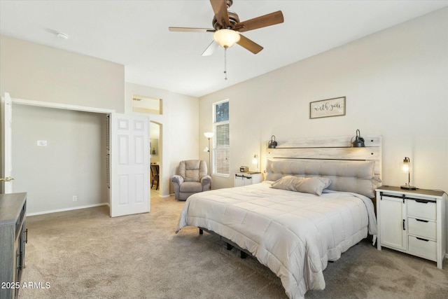 bedroom featuring ceiling fan and light carpet