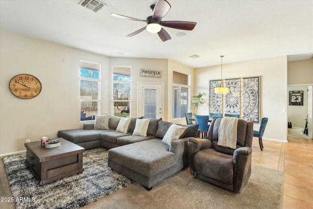 living room featuring ceiling fan and light tile patterned flooring