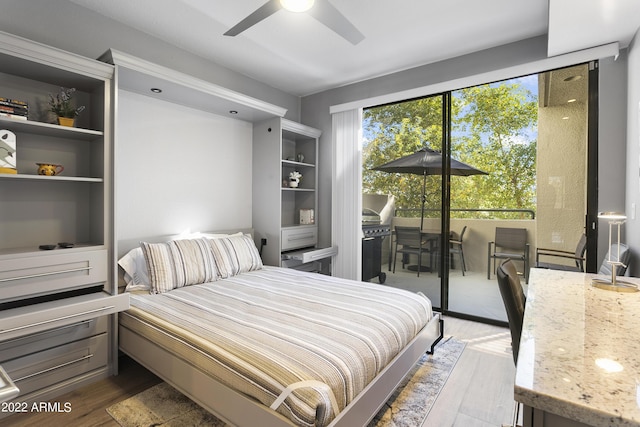 7700 E Gainey Ranch Rd Unit 206, Scottsdale, AZ 85258 - bedroom featuring wood finished floors, access to outside, and a ceiling fan