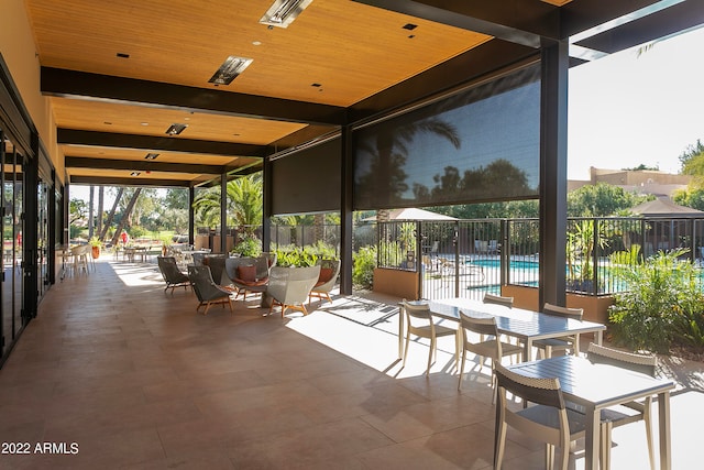 unfurnished sunroom featuring wooden ceiling