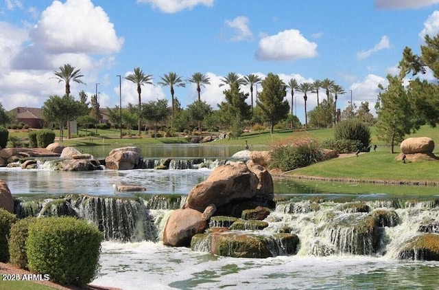 surrounding community featuring a water view