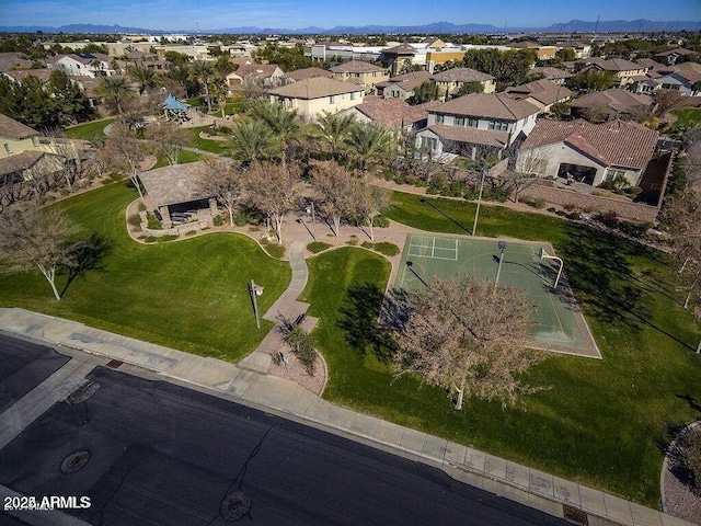 drone / aerial view featuring a residential view and a mountain view