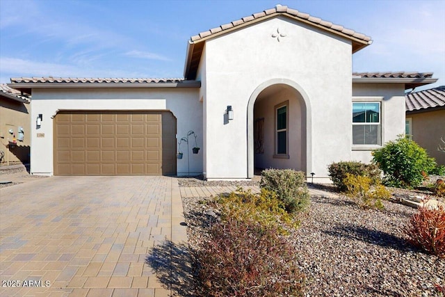 mediterranean / spanish house featuring a garage