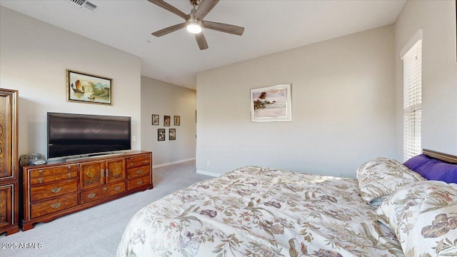 bedroom with light colored carpet and ceiling fan