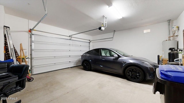 garage with a garage door opener and electric water heater