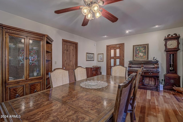 dining area featuring ceiling fan and hardwood / wood-style floors