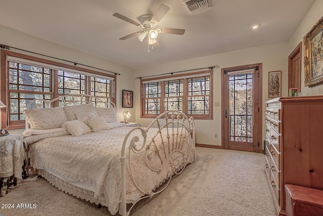 carpeted bedroom featuring access to exterior and ceiling fan