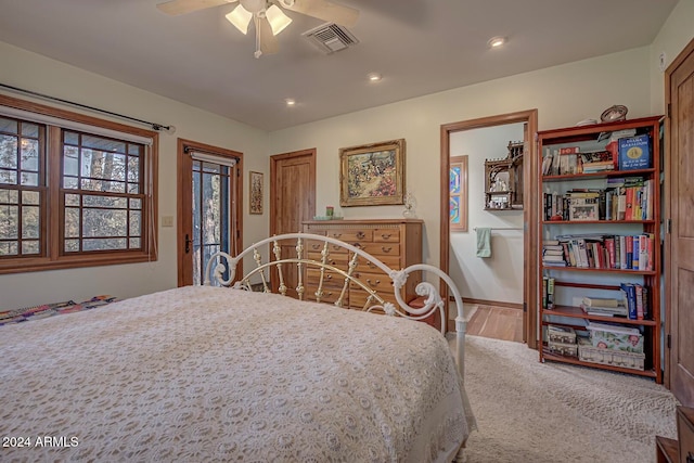 carpeted bedroom with ceiling fan