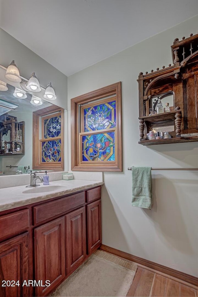 bathroom featuring hardwood / wood-style floors and vanity