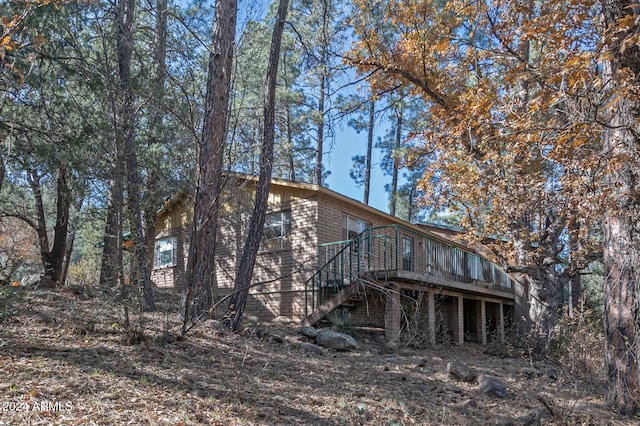 back of property featuring a deck