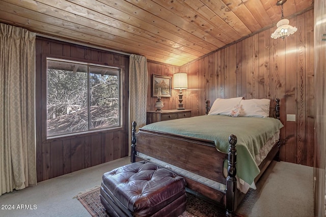 bedroom with wood walls, carpet floors, and wood ceiling