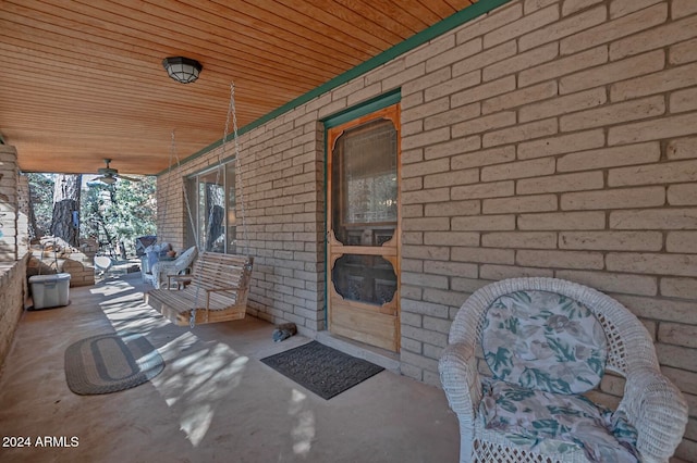 view of exterior entry with ceiling fan