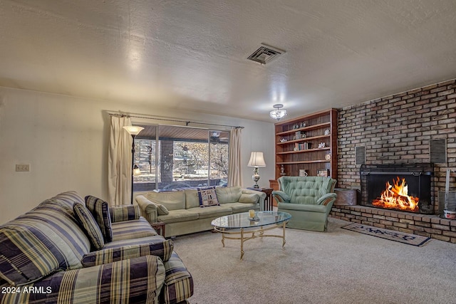 carpeted living room with a fireplace and a textured ceiling