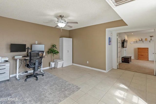 office area with light tile patterned floors, a ceiling fan, and visible vents