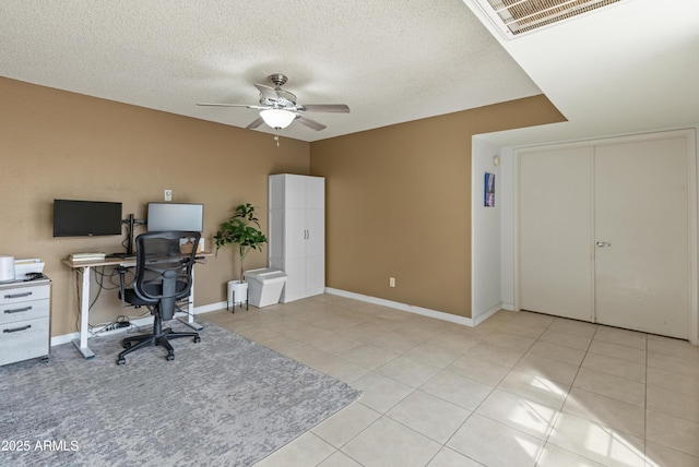 office space featuring light tile patterned flooring, visible vents, and ceiling fan