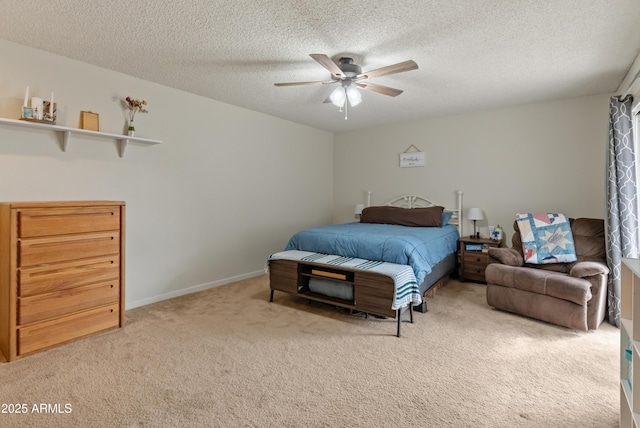 bedroom featuring carpet flooring, a ceiling fan, baseboards, and a textured ceiling