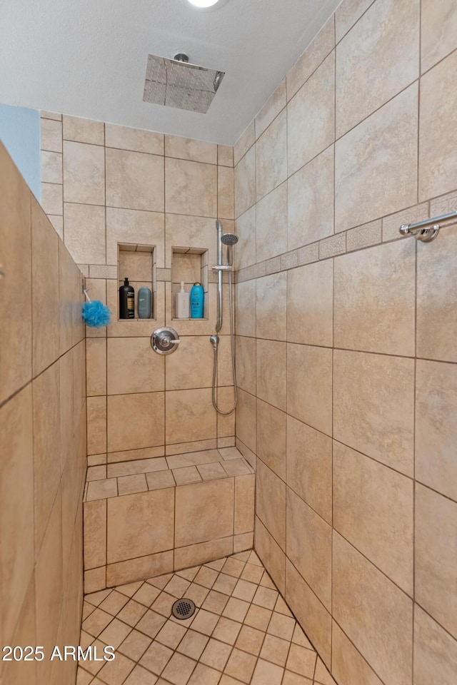 full bath featuring a tile shower