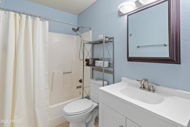 bathroom featuring vanity, shower / tub combo, and toilet