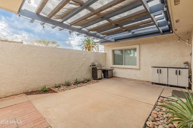 view of patio / terrace with fence and a pergola