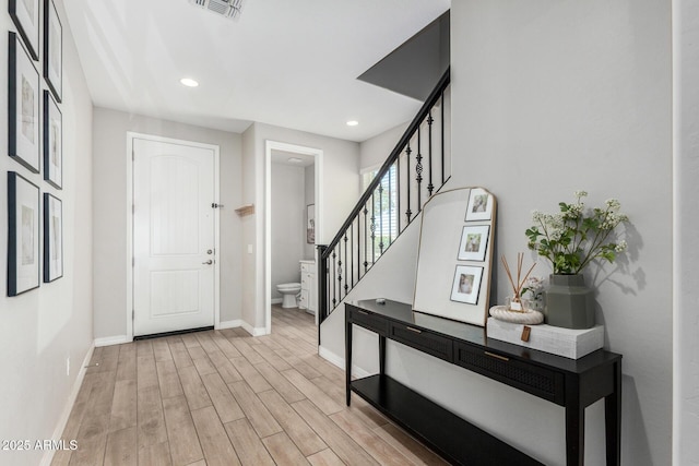 11526 E Shepperd Ave, Mesa, AZ 85212 - entryway with baseboards, light wood finished floors, stairs, and recessed lighting