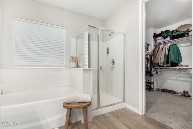 11526 E Shepperd Ave, Mesa, AZ 85212 - full bathroom featuring wood finished floors, a shower stall, a walk in closet, and a bath