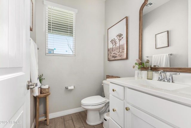 11526 E Shepperd Ave, Mesa, AZ 85212 - bathroom featuring toilet, wood finished floors, baseboards, and vanity