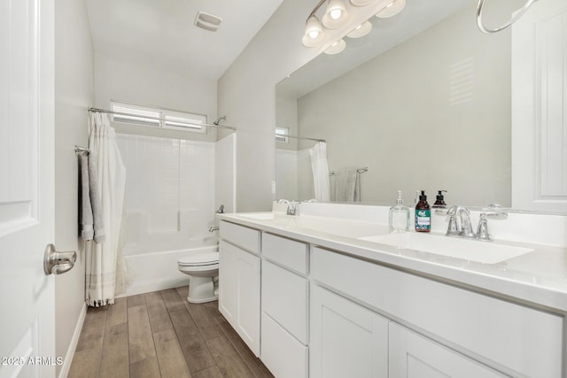 11526 E Shepperd Ave, Mesa, AZ 85212 - bathroom with double vanity, toilet, wood finished floors, shower / tub combo, and baseboards