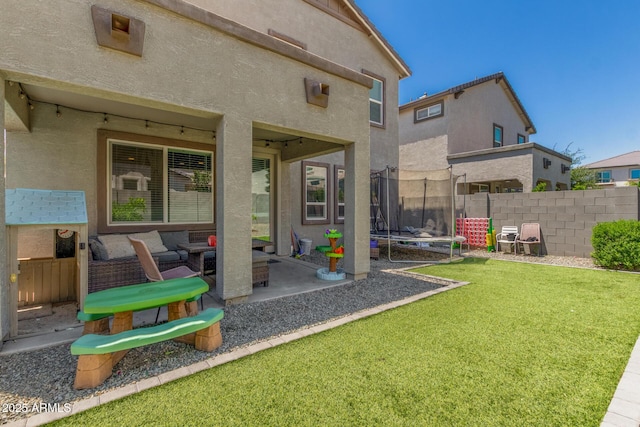 11526 E Shepperd Ave, Mesa, AZ 85212 - back of house with a trampoline, an outdoor hangout area, a patio area, and stucco siding