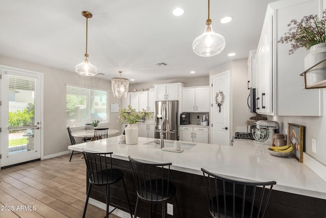 11526 E Shepperd Ave, Mesa, AZ 85212 - kitchen with appliances with stainless steel finishes, a sink, light countertops, white cabinetry, and recessed lighting