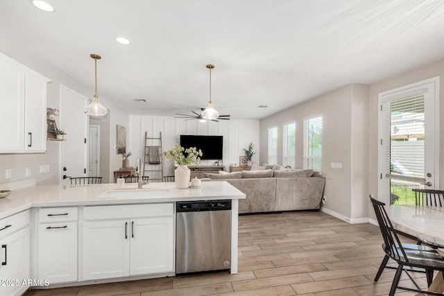 11526 E Shepperd Ave, Mesa, AZ 85212 - kitchen with stainless steel dishwasher, a sink, a peninsula, a ceiling fan, and light wood-style floors