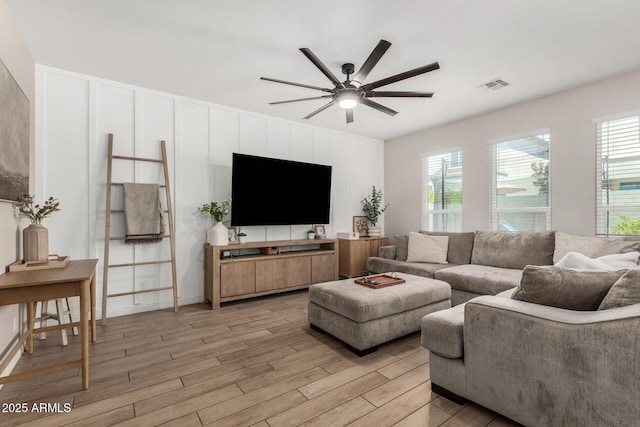 11526 E Shepperd Ave, Mesa, AZ 85212 - living room featuring light wood finished floors and ceiling fan