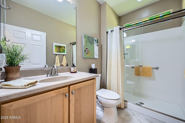 full bathroom with tile patterned flooring, toilet, a shower stall, and vanity