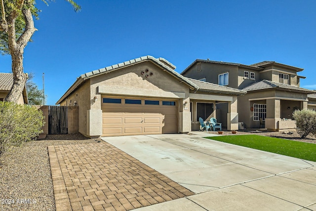 view of front of property with a garage