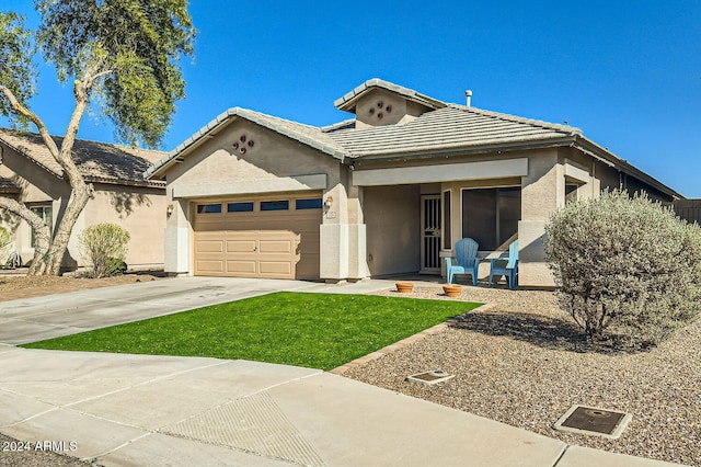 view of front of house with a garage and a front yard