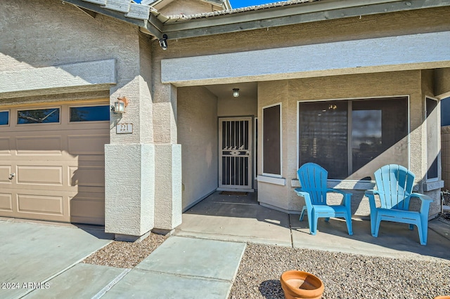 doorway to property featuring a garage