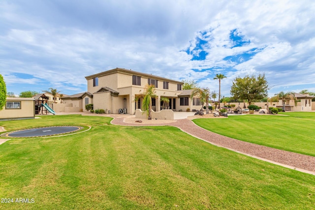 mediterranean / spanish home with fence, stone siding, concrete driveway, stucco siding, and a front lawn