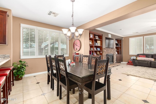 dining room featuring visible vents, a notable chandelier, baseboards, and light tile patterned floors