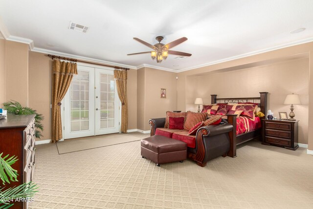 carpeted bedroom featuring access to exterior, french doors, visible vents, ornamental molding, and baseboards