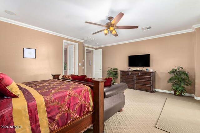 carpeted bedroom with baseboards, visible vents, ceiling fan, and ornamental molding