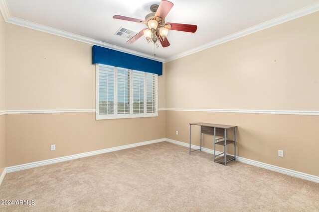 unfurnished bedroom featuring carpet, a closet, baseboards, and crown molding