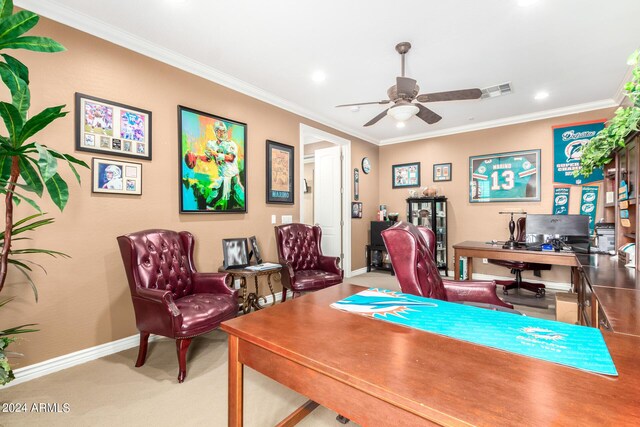 carpeted home office featuring baseboards, a ceiling fan, visible vents, and crown molding