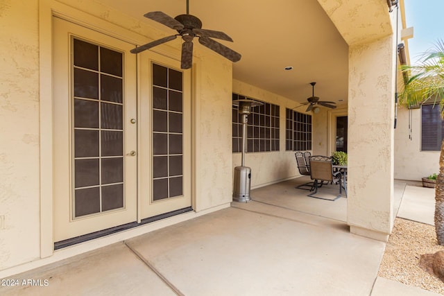 view of patio featuring a ceiling fan and french doors